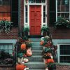 Image of pumpkins in front of stairs for Thanksgiving and Friendsgiving 2024 Blog post at Bloggey.com - Images free courtesy of Pexels.com at https://www.pexels.com/photo/pumpkins-on-stairs-in-front-of-a-door-3142467/